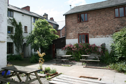 the rear yard of Compton's Yard Trust building